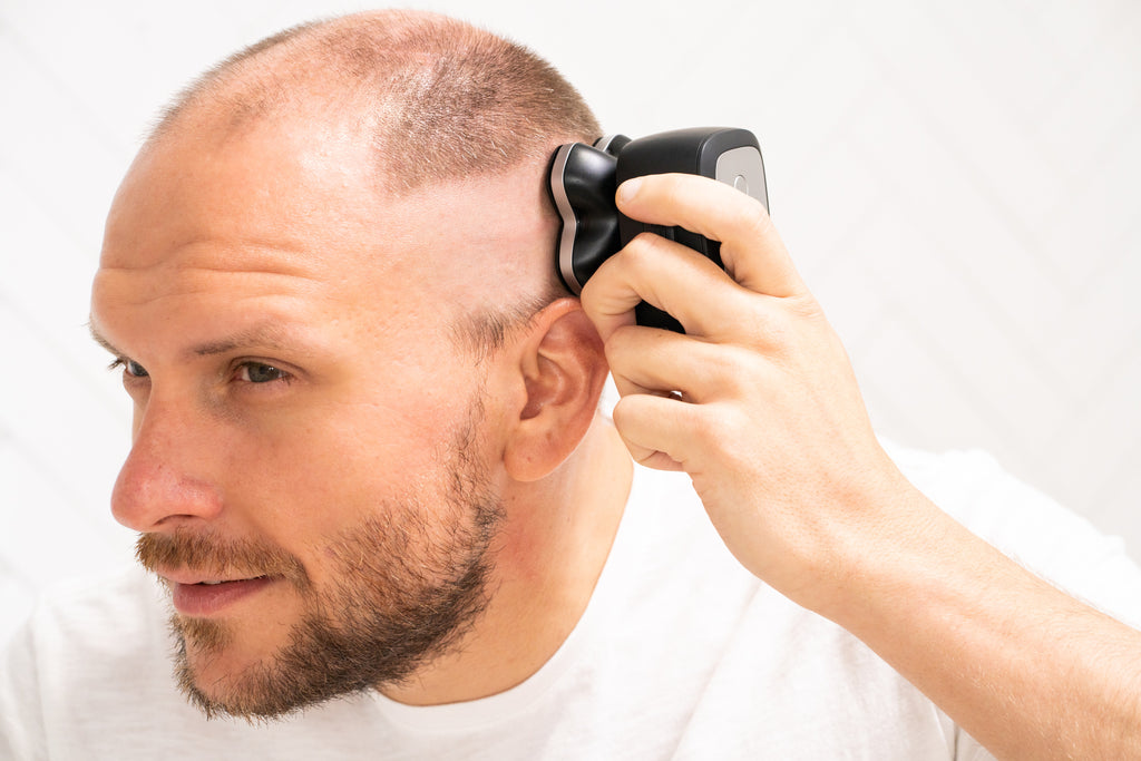 bald man shaving